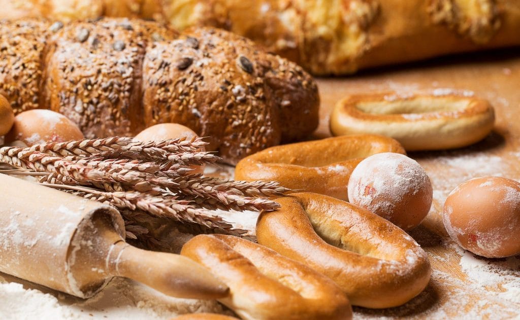 delicious bread bagels eggs table scaled 1